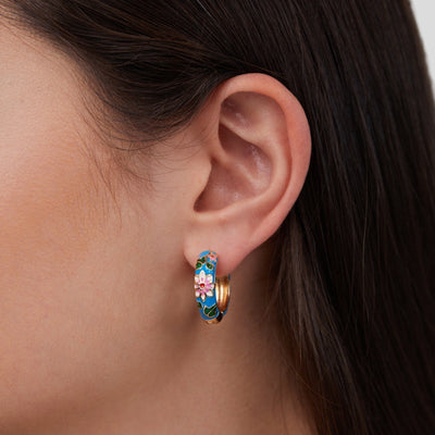Gold circle earrings with flower design