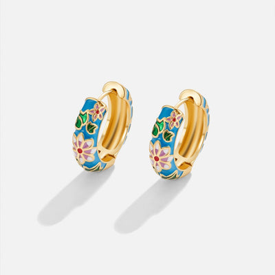 Gold circle earrings with flower design