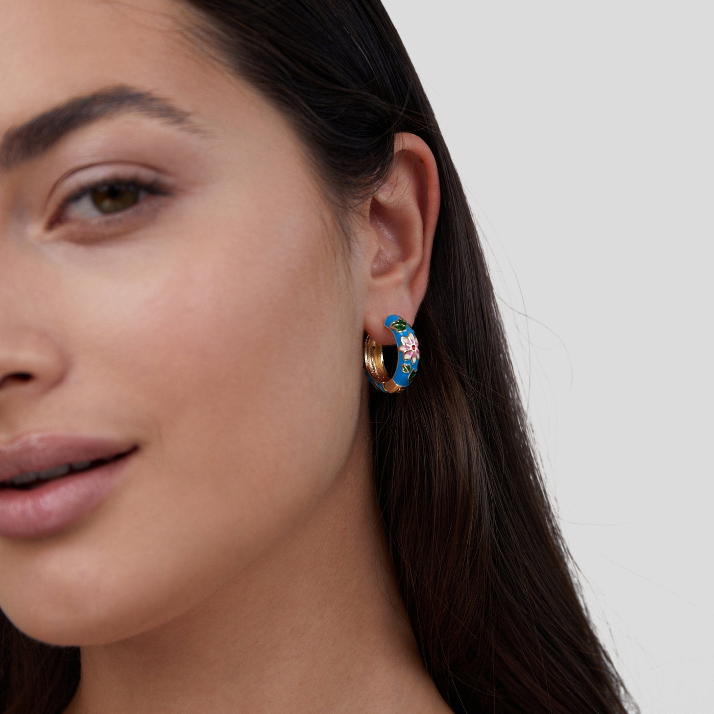 Gold circle earrings with flower design